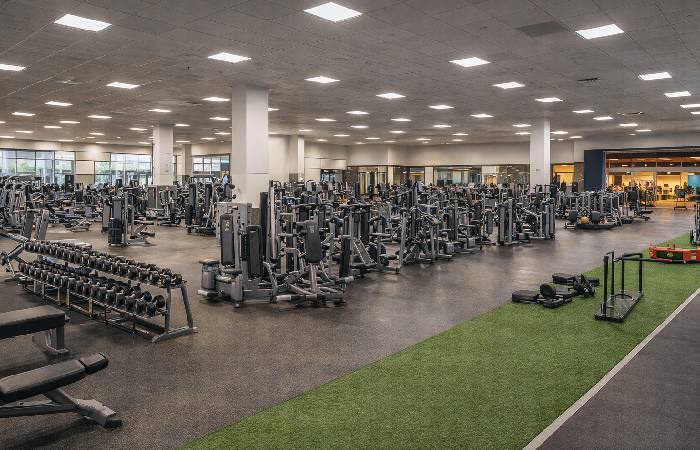 Large modern gym representing Fitness International’s brand portfolio