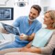 Dentist consulting patient in modern dental clinic Budapest