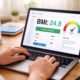 person checking BMI on laptop with health metrics
