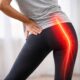 Person with sciatic nerve pain radiating from lower back to leg