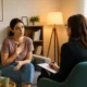 Woman discussing mental health support during a therapy session